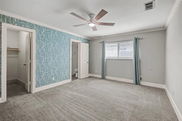 a bathroom with a toilet sink and shower