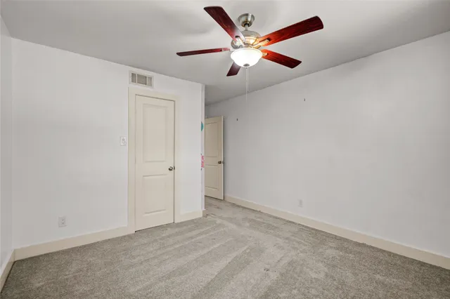 a bathroom with a shower a mirror and a sink