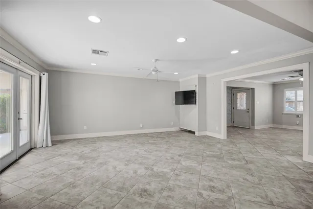 a kitchen with stainless steel appliances granite countertop white cabinets granite counter tops and a wooden floors