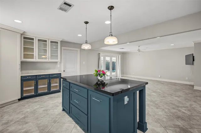 a bathroom with a toilet sink vanity and mirror