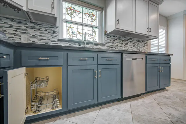 an empty room with closet and windows