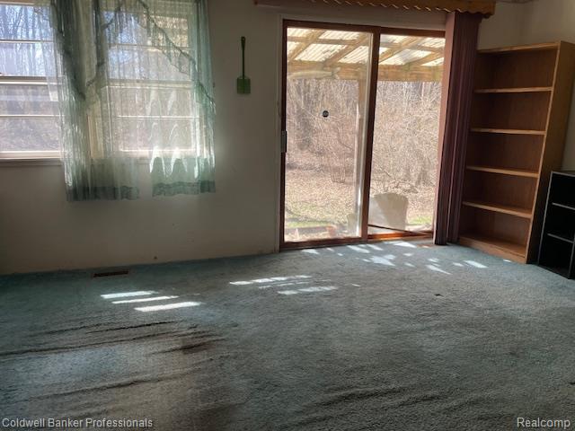 5447 Rensselear Drive Lapeer, MI 48446 - Photo 9 of 22 Or flex room with sliding door out to deck area and view of back yard. Great for watching Birds or wildlife