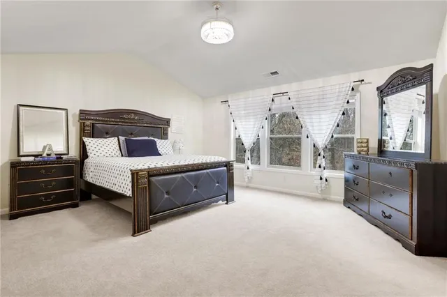 a bedroom with a bed and a closet