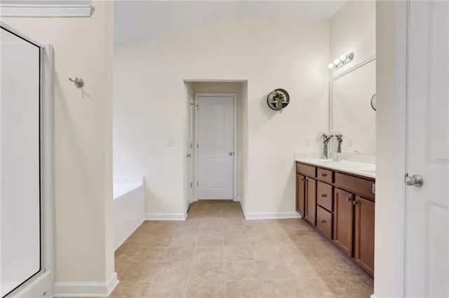 a bathroom with a double vanity sink and a mirror