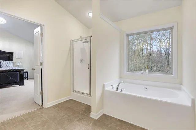 a bedroom with bed and a window