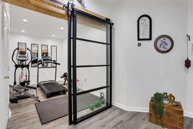 a kitchen with stainless steel appliances granite countertop a sink a stove and cabinets