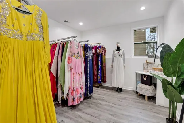 a kitchen with kitchen island a sink stainless steel appliances and cabinets