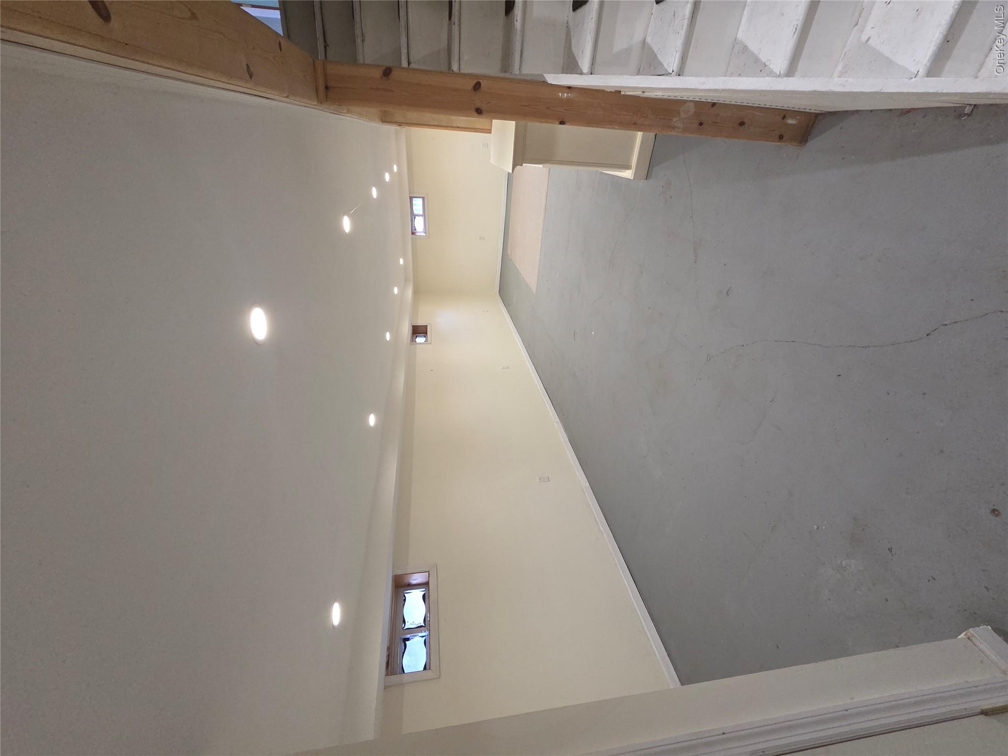 220 Raff Avenue Mineola, NY 11501 - Photo 19 of 22 Basement featuring stairs and recessed lighting