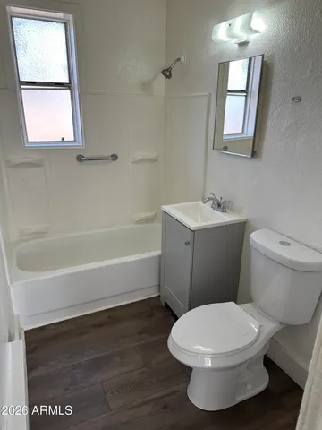 a bathroom with a toilet a sink and a bathtub