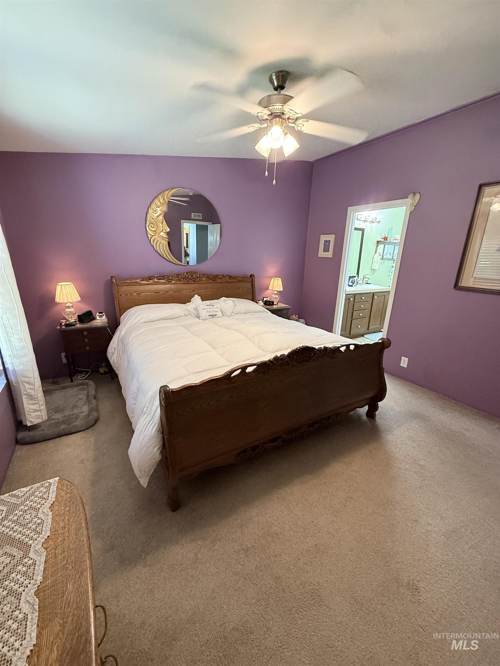 2750 Alden Road, Unit 12 12 Fruitland, ID 83619 - Photo 23 of 38 Spacious room featuring neutral-toned carpeting, a ceiling fan with integrated lighting, and a window with blinds