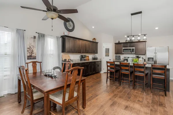 a view of a dining room with furniture window and wooden floor