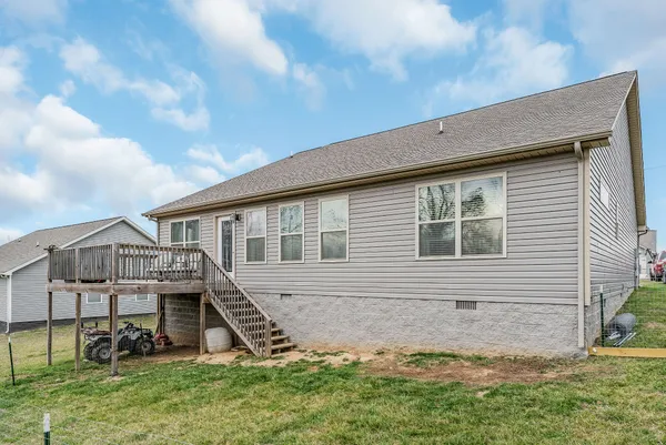 a house that has garden in front of it