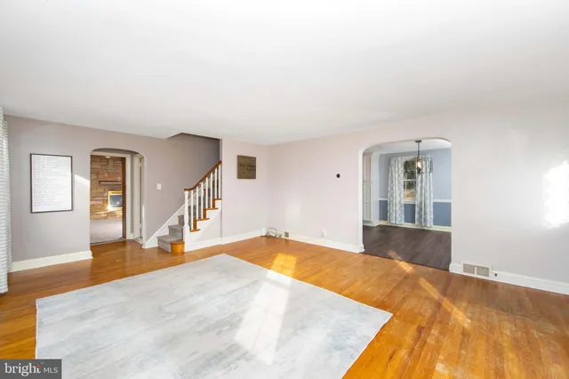 a view of a big room with windows and cabinet
