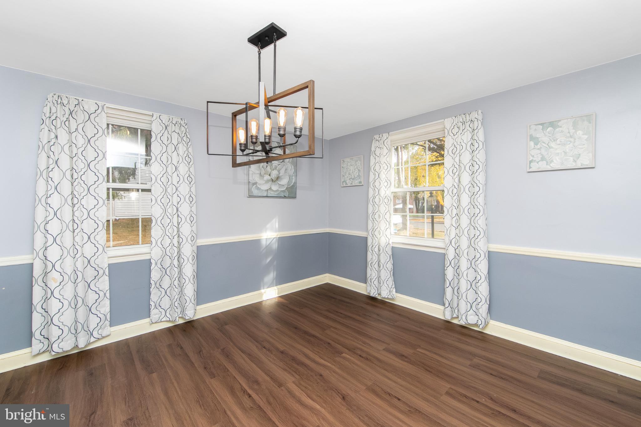 414 Stanfield Road Springfield, PA 19064 - Photo 15 of 51 a view of a livingroom with wooden floor and a ceiling fan