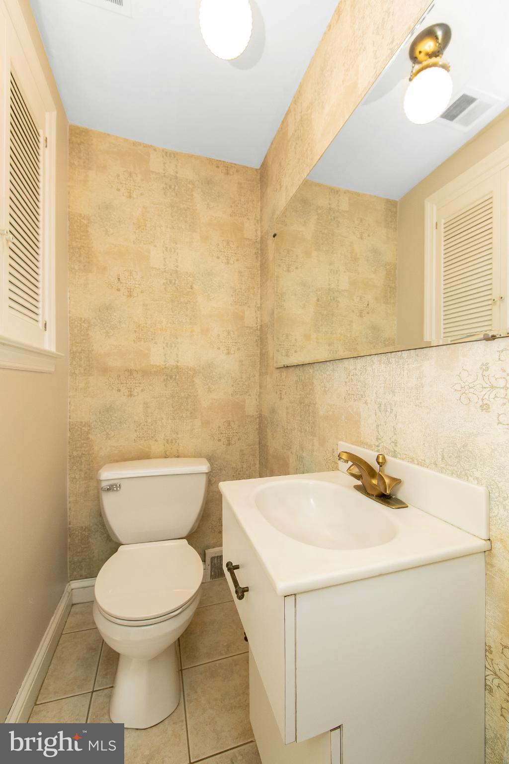 414 Stanfield Road Springfield, PA 19064 - Photo 20 of 51 a bathroom with a sink a toilet and a mirror