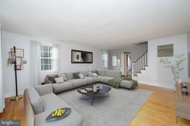 a living room with furniture and a table
