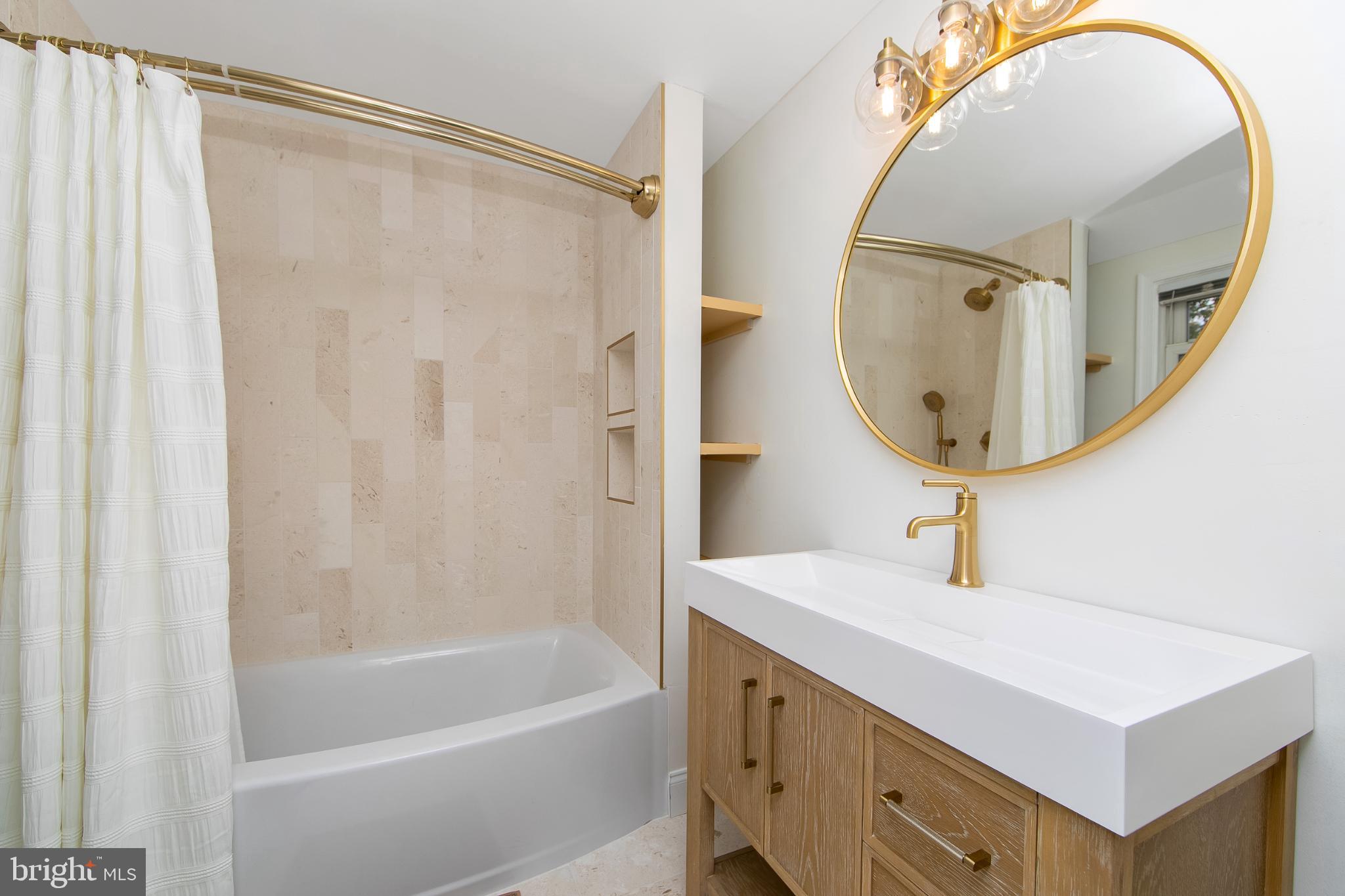 414 Stanfield Road Springfield, PA 19064 - Photo 31 of 51 a bathroom with a sink and a mirror