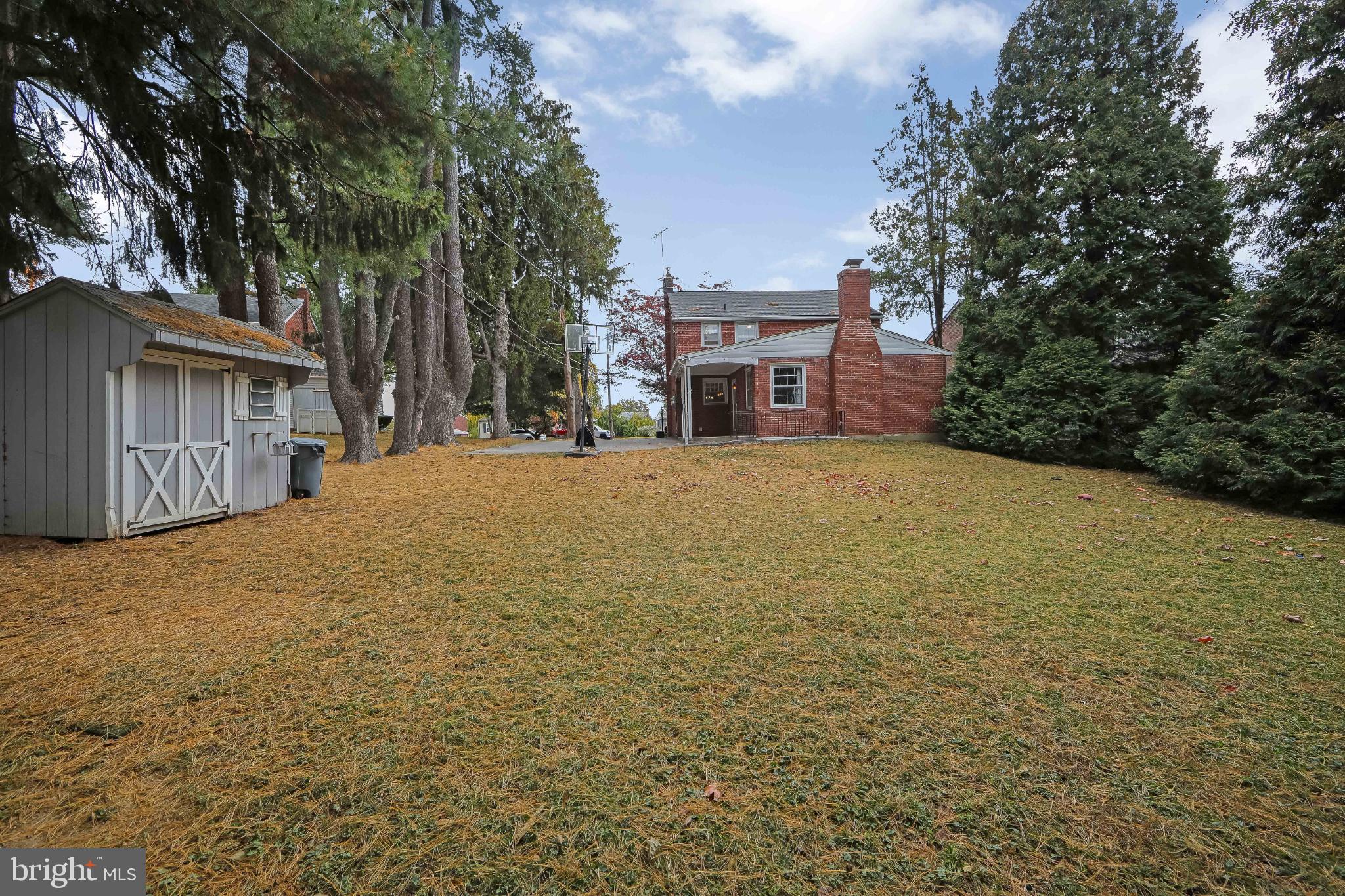 414 Stanfield Road Springfield, PA 19064 - Photo 38 of 51 a large house with a large tree in front of it