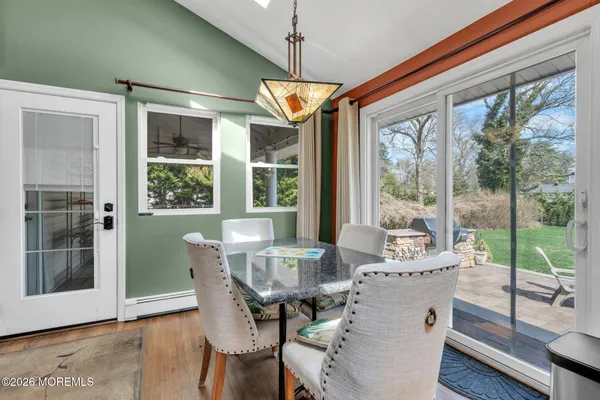 a kitchen with stainless steel appliances kitchen island granite countertop a refrigerator a stove top oven a sink and dishwasher