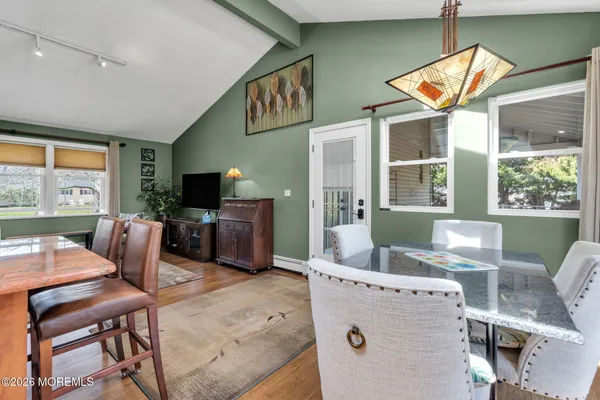 a large kitchen with stainless steel appliances granite countertop a sink and cabinets