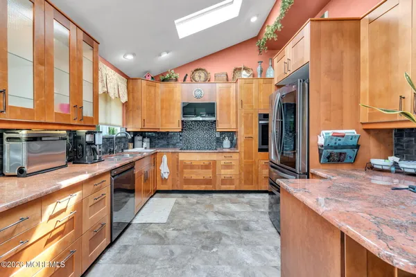 a bathroom with a sink a mirror and a toilet