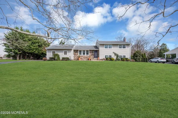a view of a house with a big yard