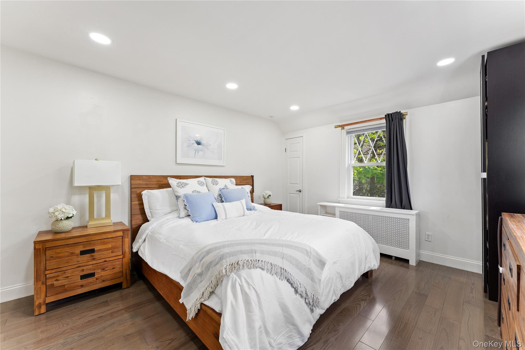 5 Jefferson Road Scarsdale, NY 10583 - Photo 12 of 23 The primary bedroom features new hardwood floors, recessed lighting, and large windows for natural light.