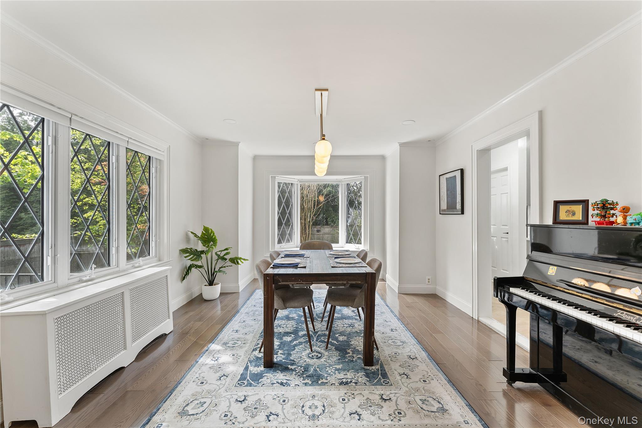 5 Jefferson Road Scarsdale, NY 10583 - Photo 9 of 23 The beautiful, large windows flood the room with natural light and overlook the backyard.