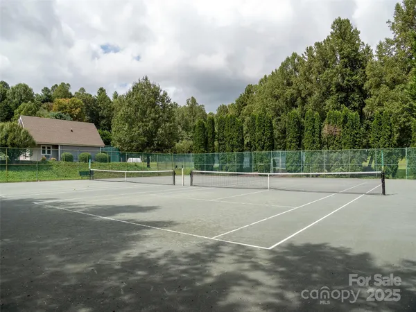 a view of a lake with houses in the back