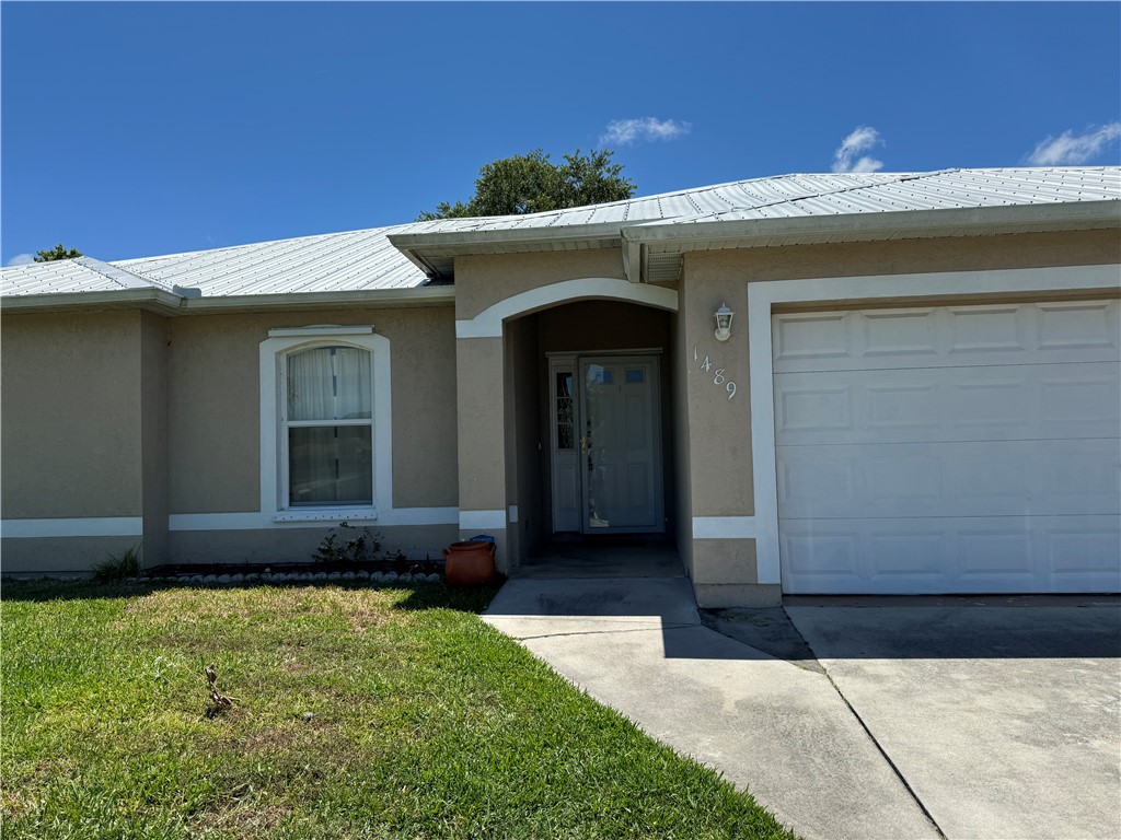 1489 Whitmore Street Sebastian, FL 32958 - Photo 2 of 24 a front view of a house