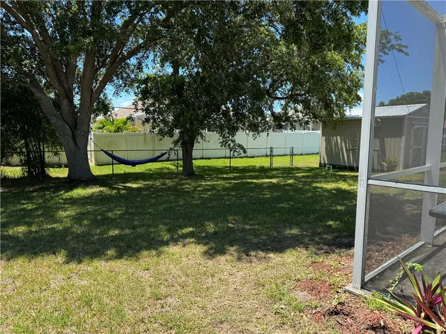 a view of backyard with green space