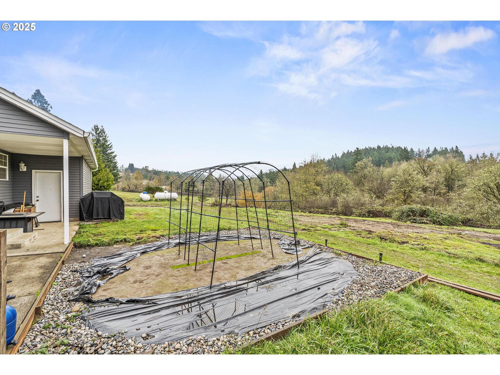 1707 Northwest 354th Street La Center, WA 98629 - Photo 12 of 31 a view of a backyard and a mountain
