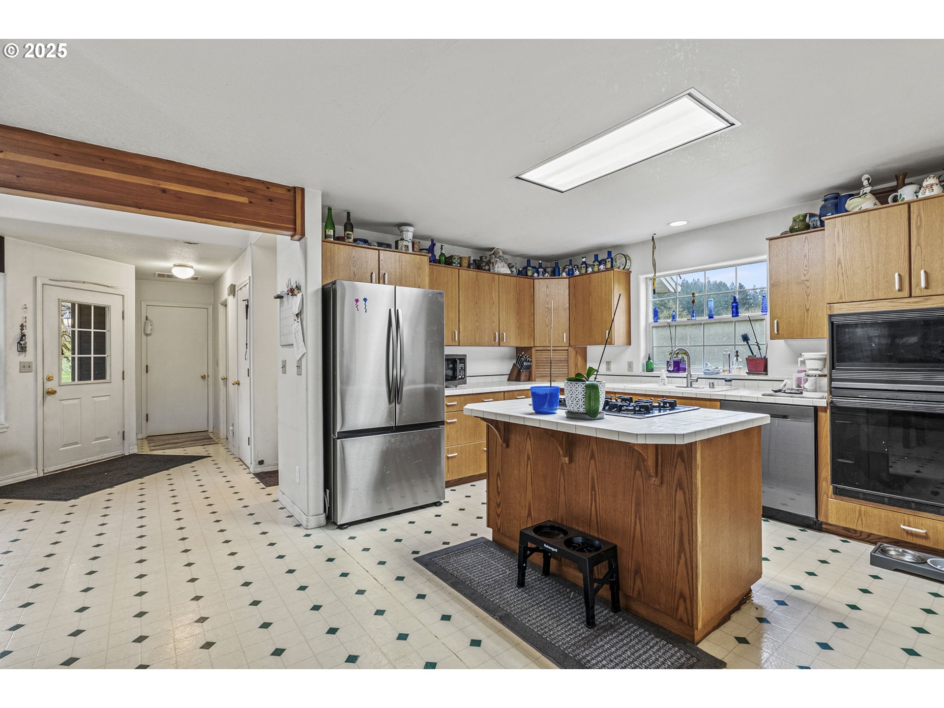 1707 Northwest 354th Street La Center, WA 98629 - Photo 16 of 31 a kitchen with a refrigerator a sink and dishwasher