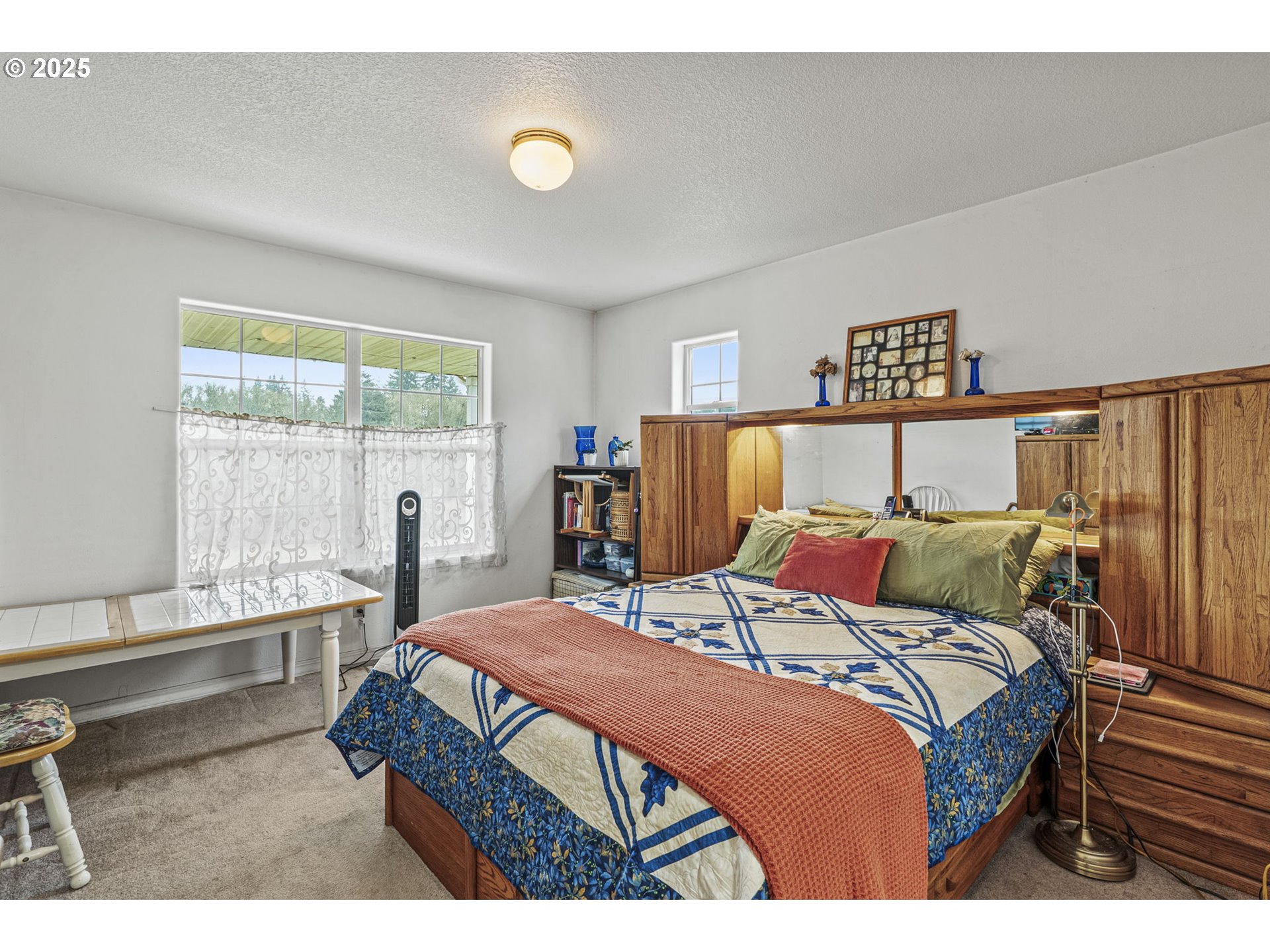 1707 Northwest 354th Street La Center, WA 98629 - Photo 21 of 31 a bedroom with a bed and a large window