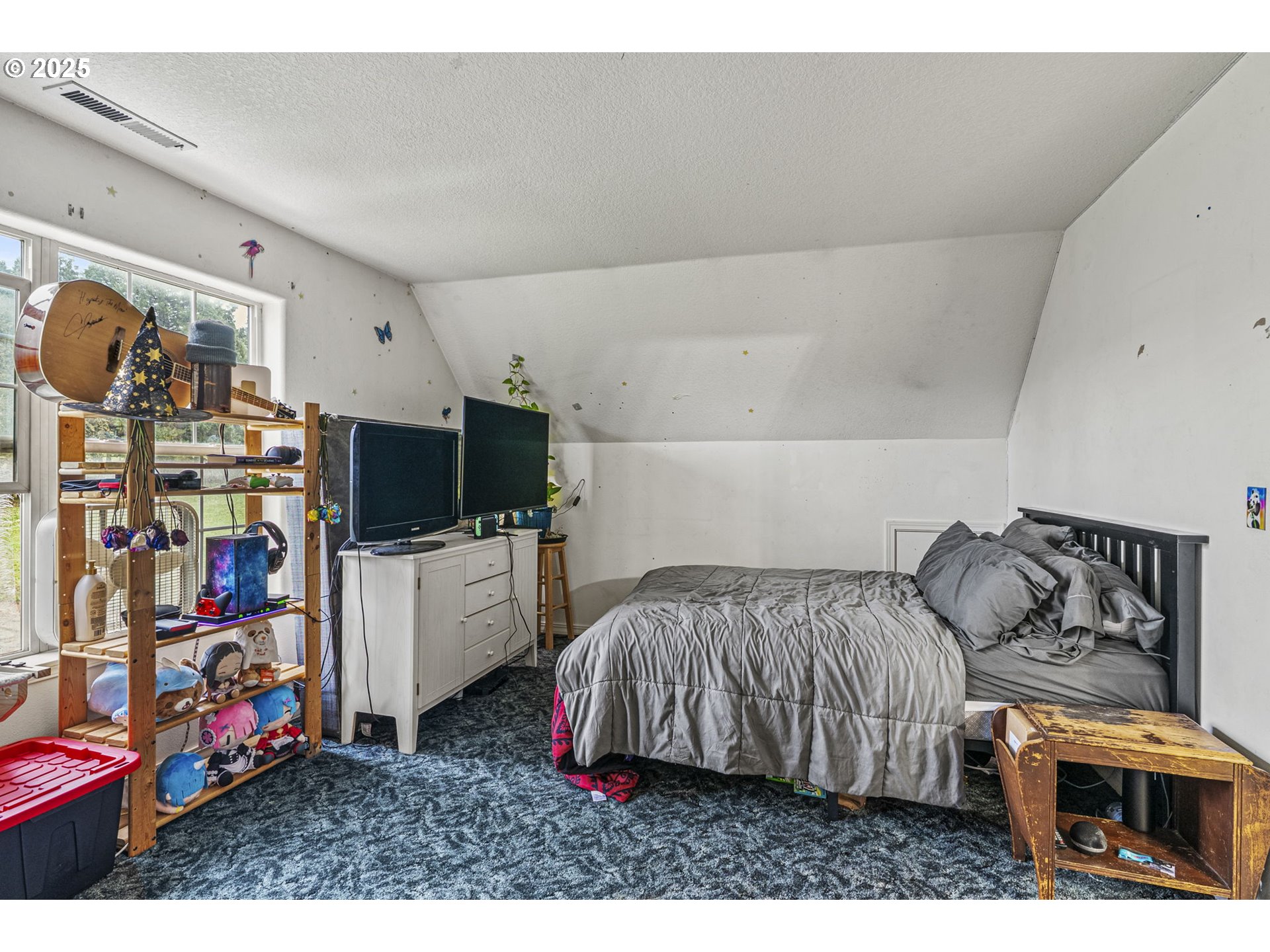 1707 Northwest 354th Street La Center, WA 98629 - Photo 30 of 31 a bedroom with furniture and a flat screen tv