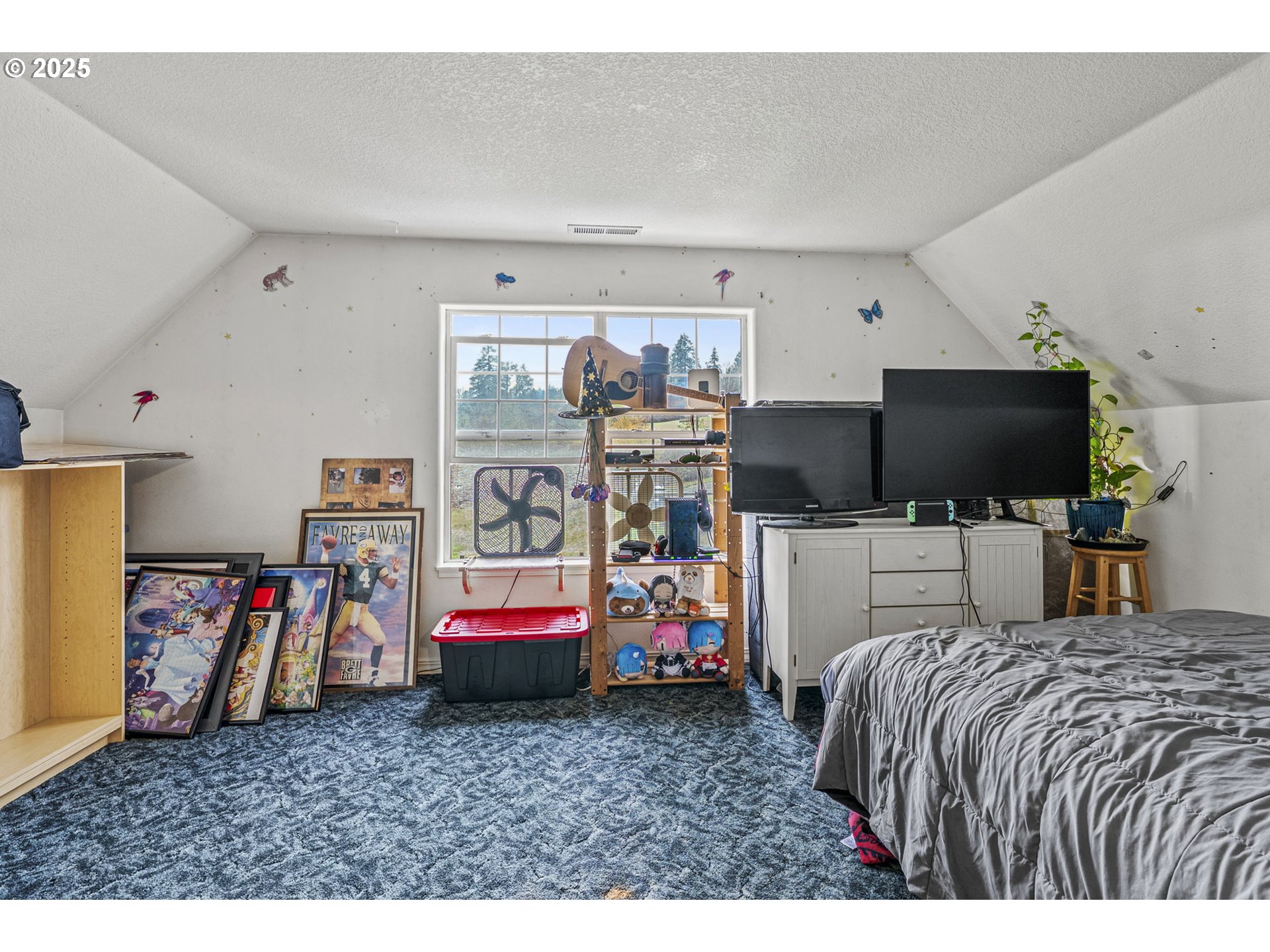 1707 Northwest 354th Street La Center, WA 98629 - Photo 31 of 31 a bedroom with bed and a flat tv screen