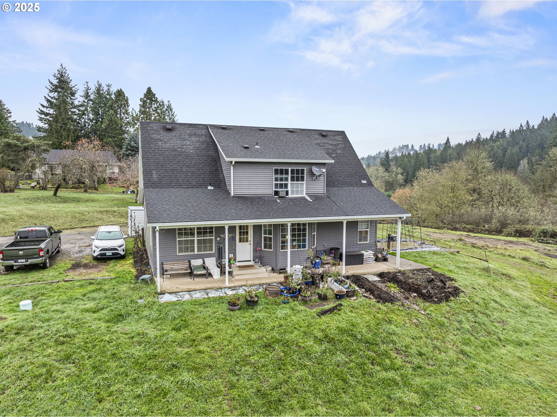 1707 Northwest 354th Street La Center, WA 98629 - Photo 4 of 31 a view of a house with backyard porch and garden