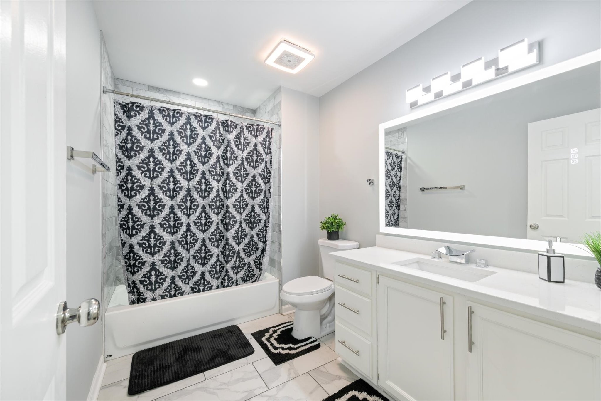 165 Ellington Place Madison, TN 37115 - Photo 15 of 26 a bathroom with a sink a toilet a mirror a vanity and shower