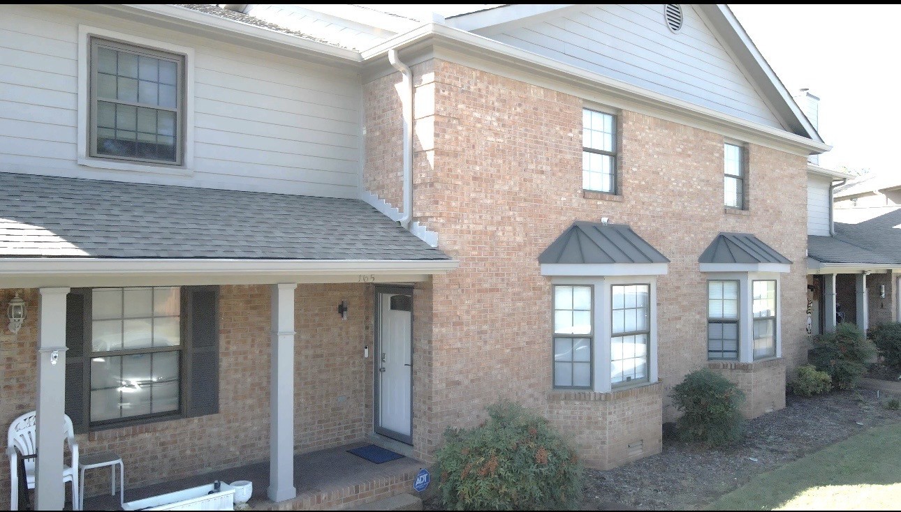 165 Ellington Place Madison, TN 37115 - Photo 2 of 26 a view of a brick house with many windows