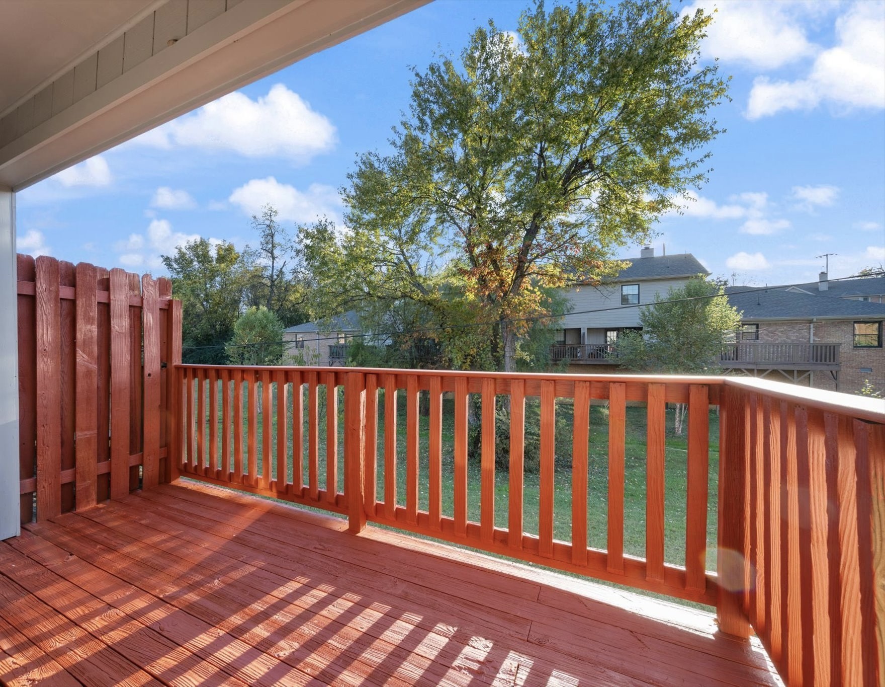 165 Ellington Place Madison, TN 37115 - Photo 23 of 26 a balcony with wooden floor and fence