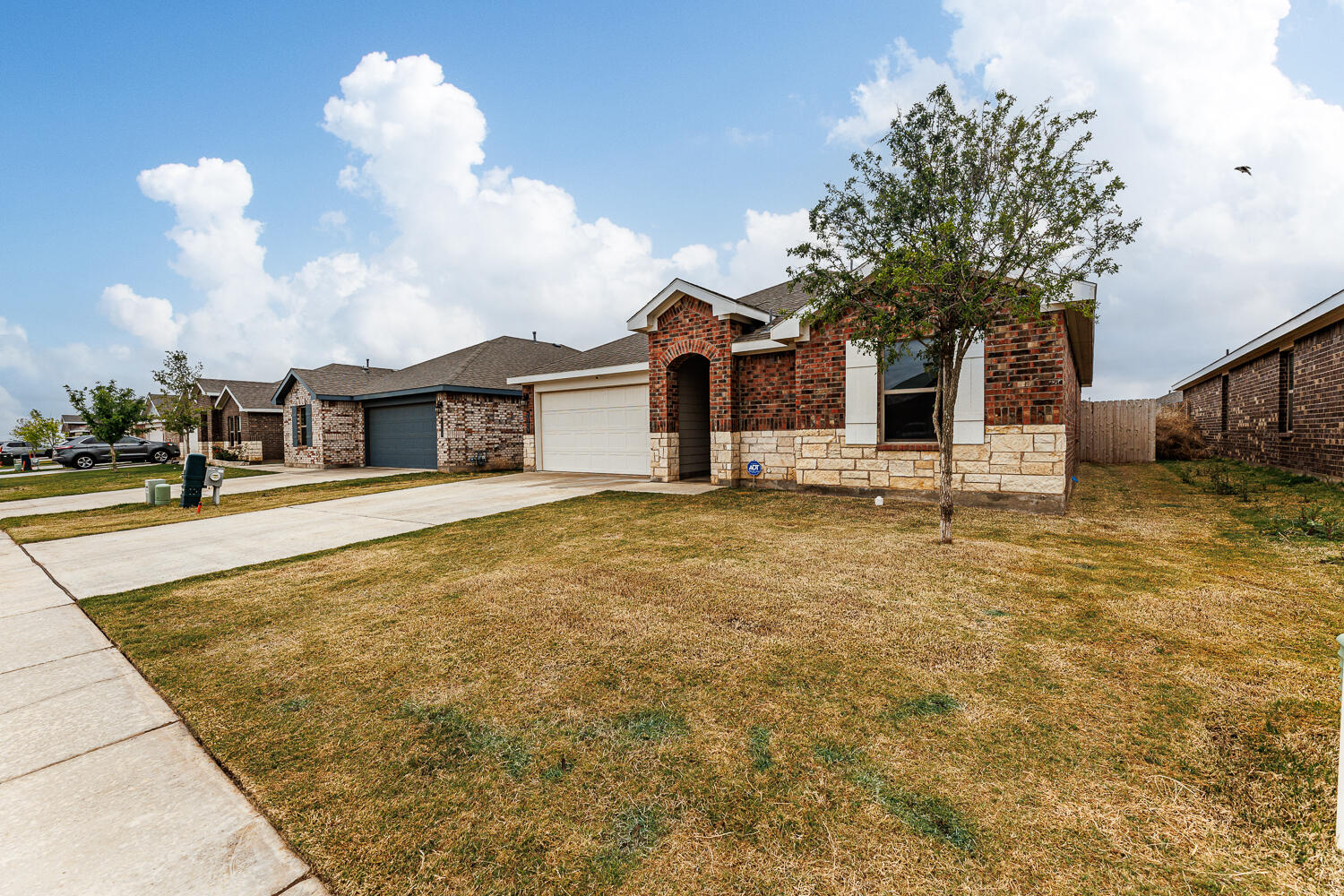 2305 150th Street Lubbock, TX 79423 - Photo 38 of 39 a front view of a house with garden