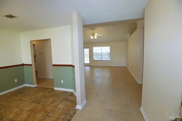 a view of a room with door and stairs