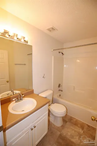 a bathroom with a sink toilet tub and shower