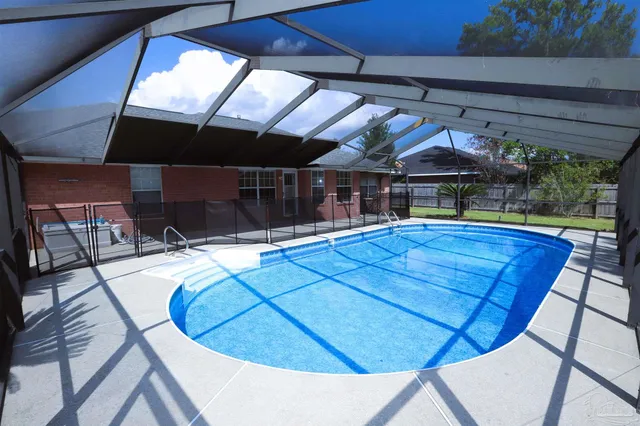 a view of a swimming pool with a patio