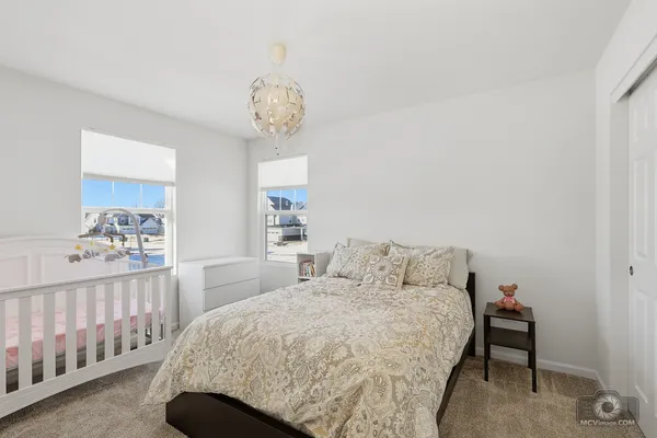 a bedroom with a bed and a window in it