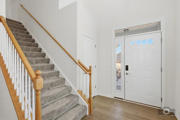 a view of a hallway with staircase