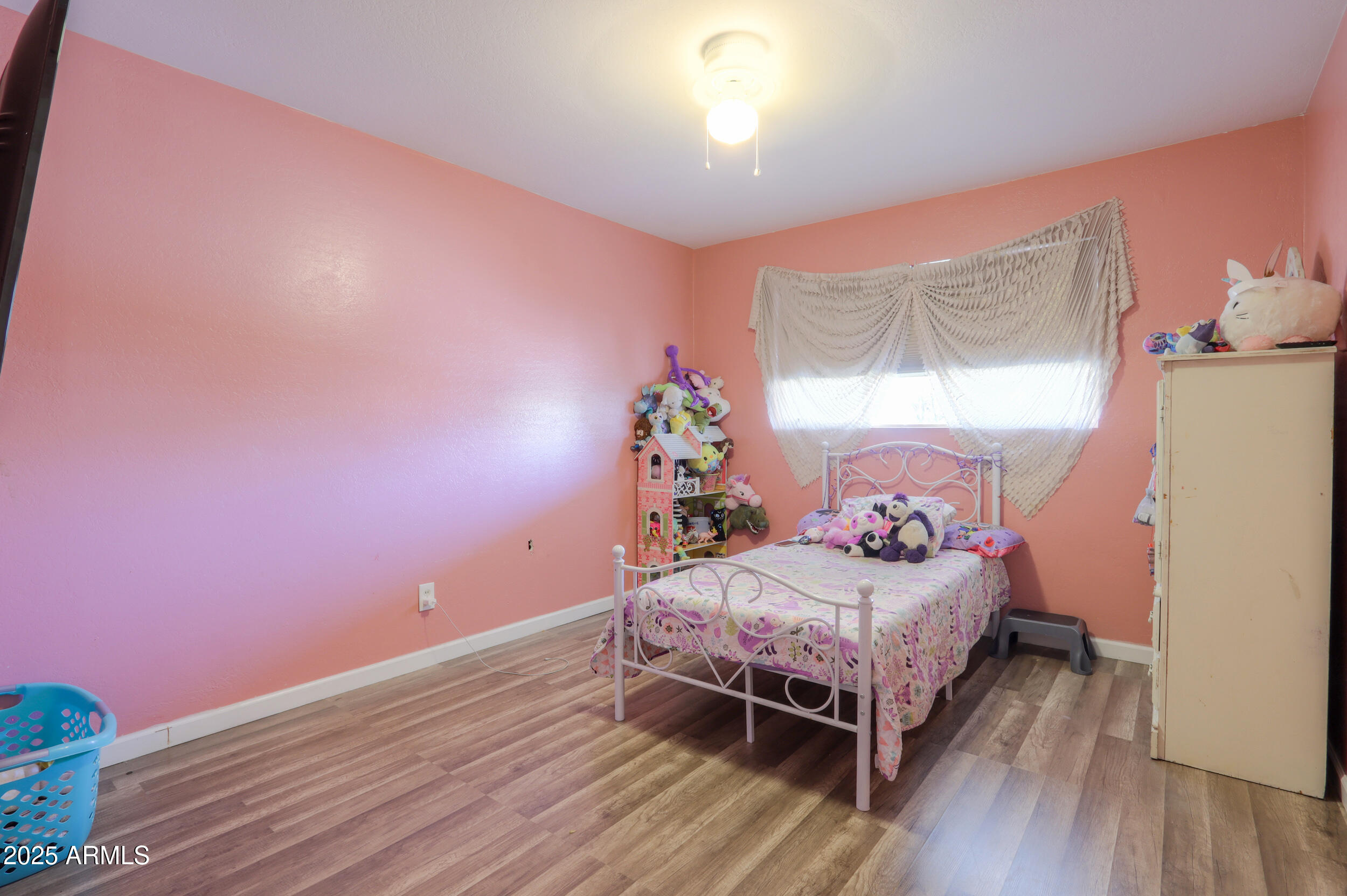 3413 West Ocotillo Road Phoenix, AZ 85017 - Photo 16 of 29 a bedroom with a bed and a window