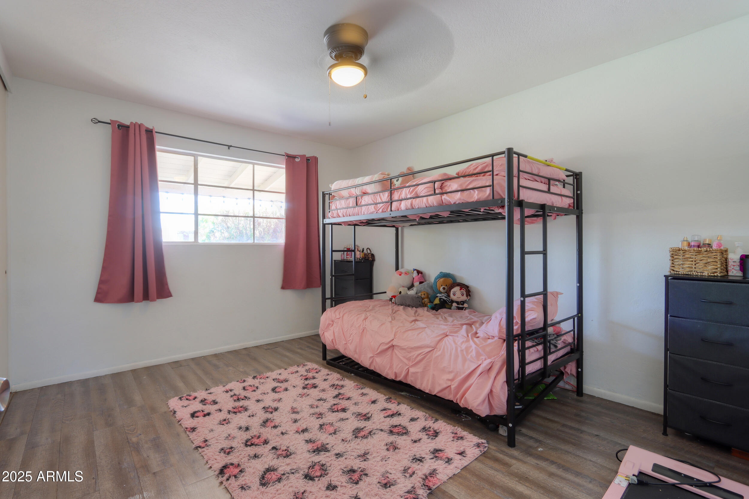 3413 West Ocotillo Road Phoenix, AZ 85017 - Photo 18 of 29 a bedroom with a bed and a window