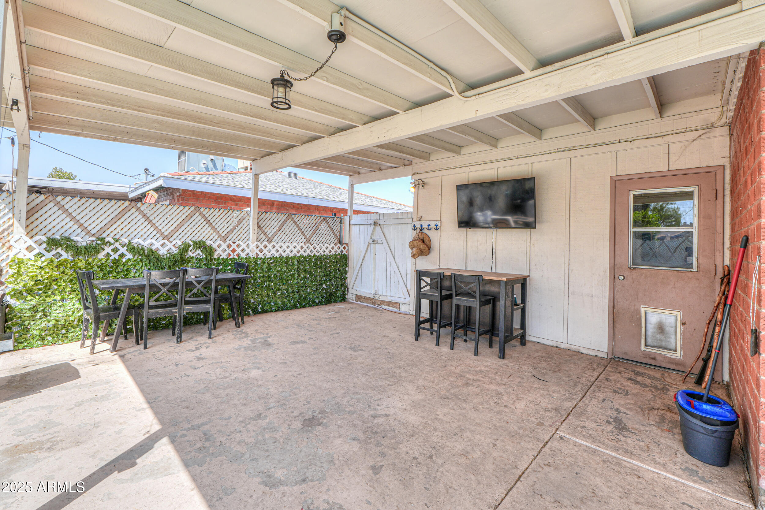 3413 West Ocotillo Road Phoenix, AZ 85017 - Photo 23 of 29 a view of a patio with table and chairs