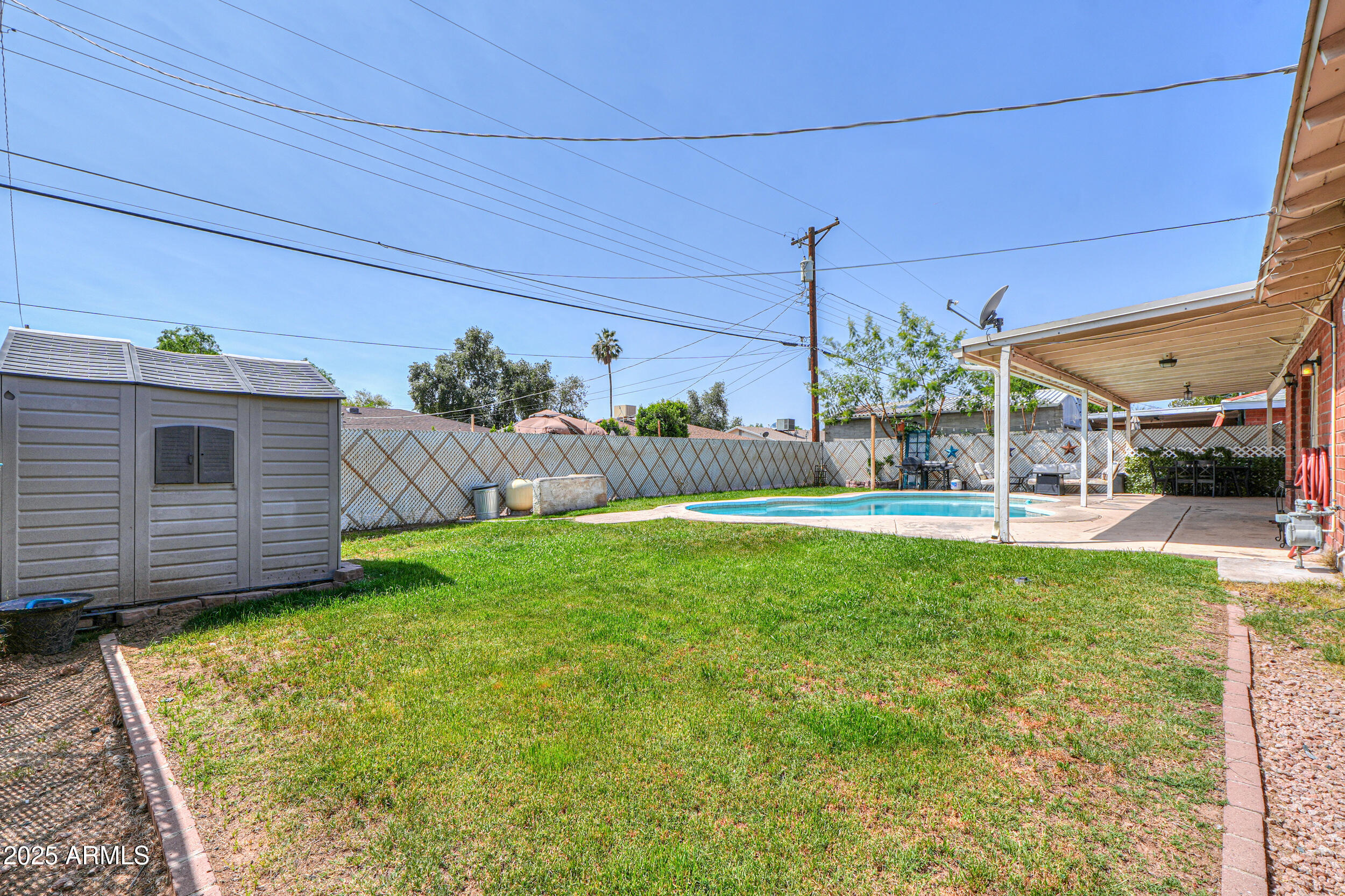 3413 West Ocotillo Road Phoenix, AZ 85017 - Photo 27 of 29 a view of a house with a backyard